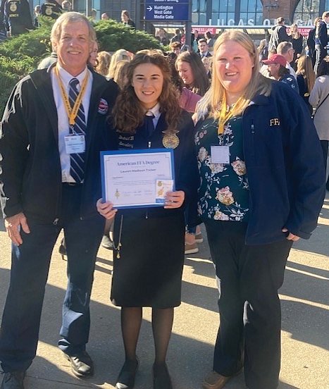 Southmont FFA Advisor Gary Mosbaugh, poses with Lauren Tricker, an American Degree recipient, and Southmont FFA Advisor Erin Gilley outside of Lucas Oil Stadium. Last weekend was the 95th National FFA Convention & Expo held in Indianapolis on Oct. 26-29. American Degree. The American FFA Degree is the highest honor awarded to FFA members who have demonstrated the highest level of commitment to FFA and made significant accomplishments in their supervised agricultural experience.