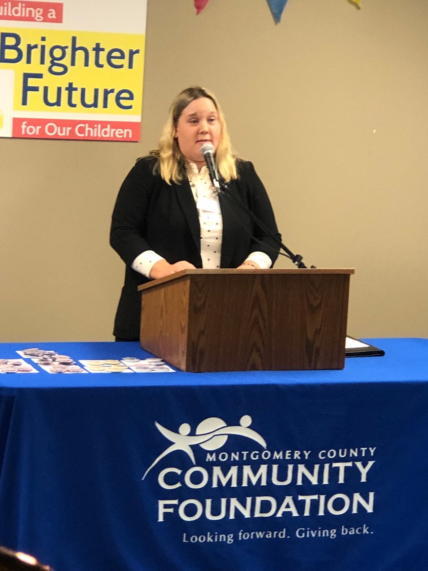 Lisa Walters, MCCF Early Learning Director, addresses community members who gathered Thursday at the former South Boulevard County Office building to learn more about the project that will transform the site into a high-quality child care provider.