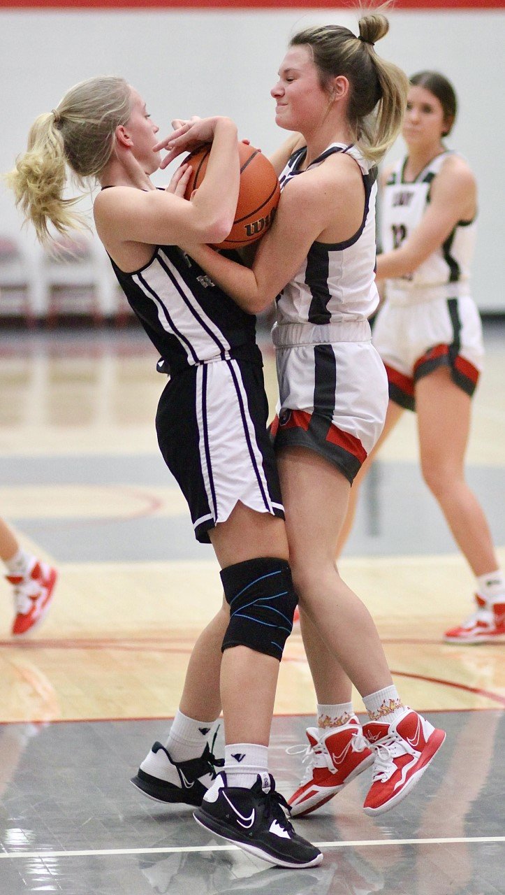 Saylor Woods battles for possesion of the ball.