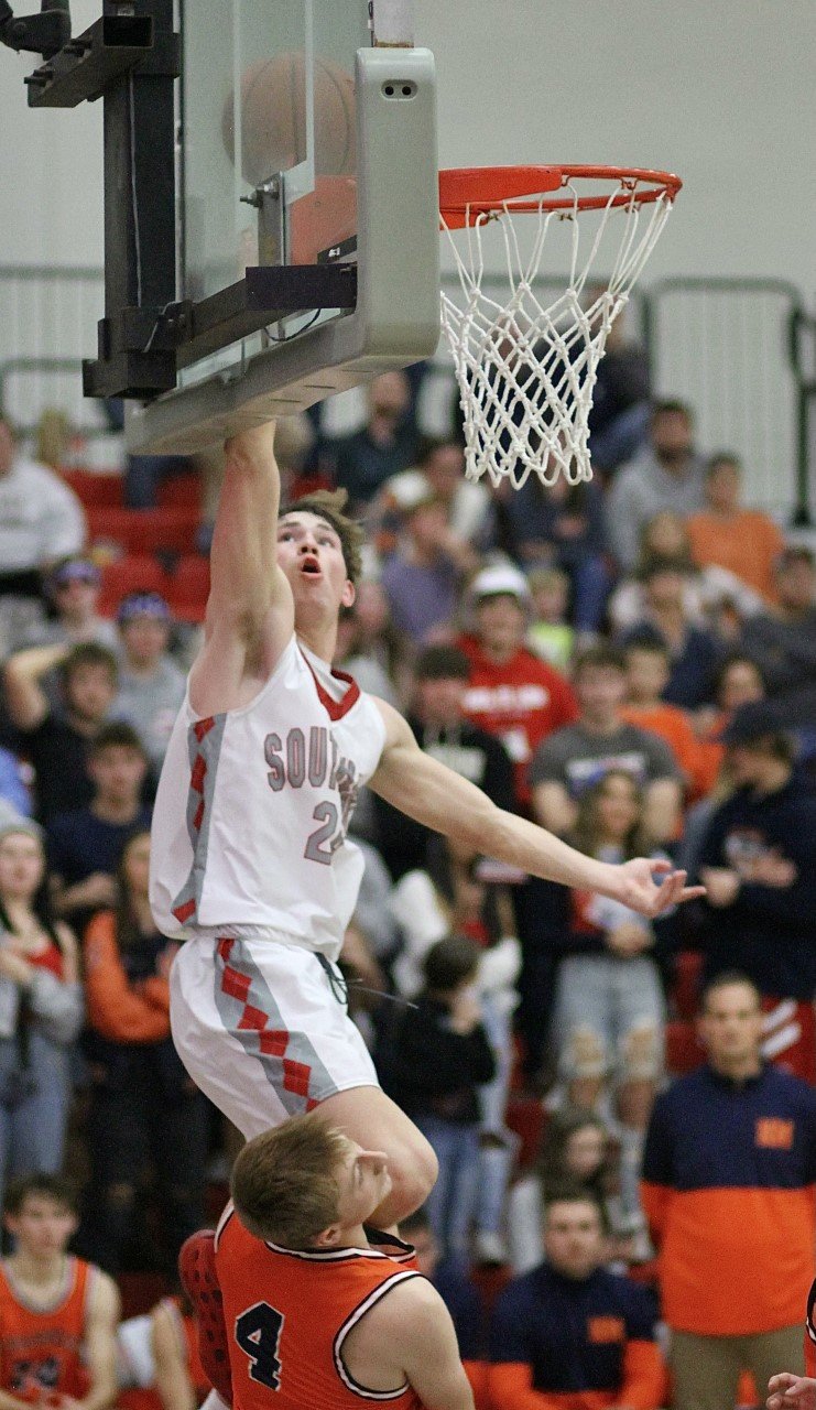 North Montgomery's Jarrod Kirsch takes a charging call from Southmont's EJ Brewer.
