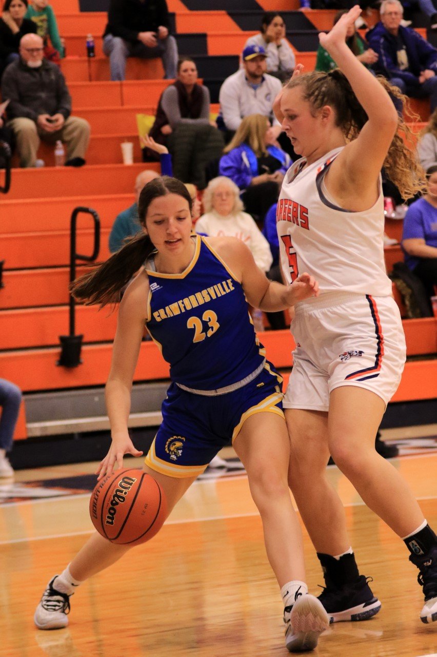 Crawfordsville's Taylor Abston (19 points) and North Montgomery's Piper Ramey (15 points) battled all night long in the post.