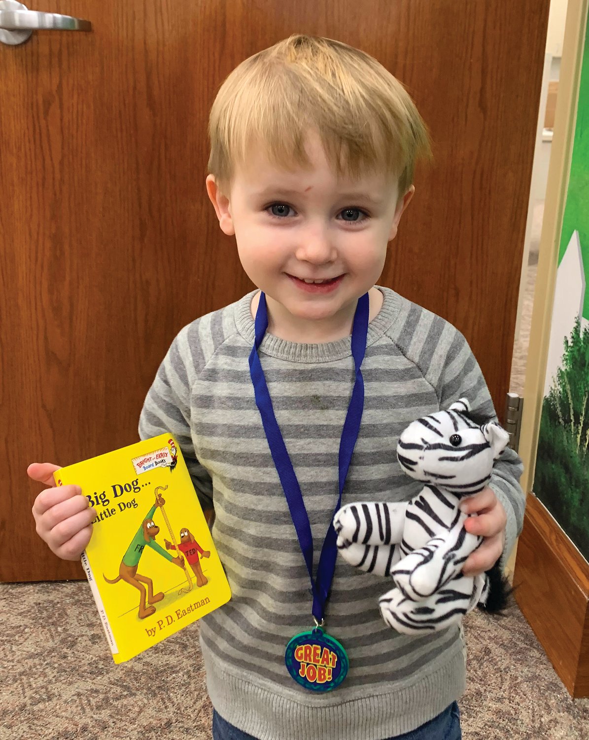 Tommy Smillie, age 2 1/2, has completed the 1,000 Books Before Kindergarten at the Crawfordsville District Public Library. He is the son of John Smillie and Katie Ansaldi. His favorite book is "The Very Hungry Caterpillar"by Eric Carle. Mom said, "Reading the 1,000 books has been a special part of our family's day. We love coming to the library and checking out new books!"