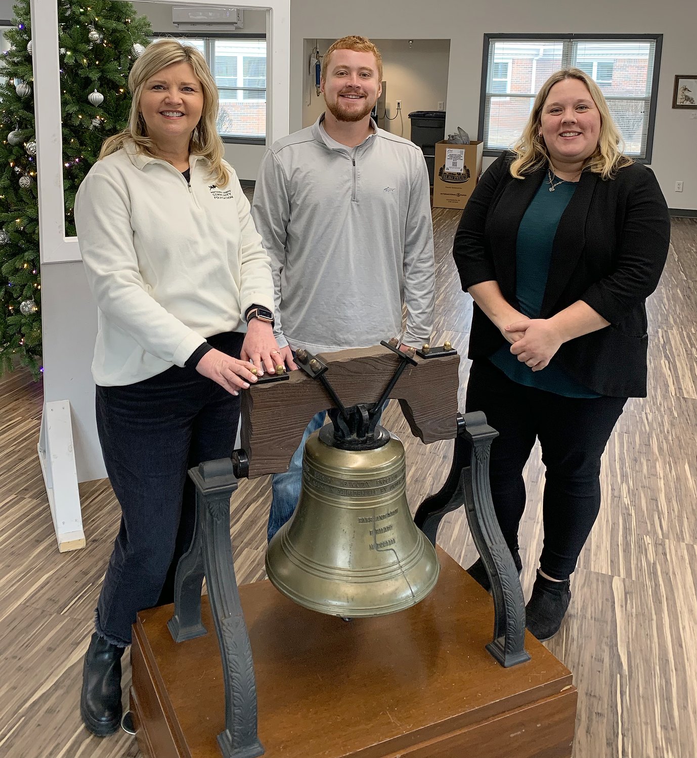 Kelly Taylor, Devan Guard and Lisa Walters of the Montgomery County Community Foundation pose by the Liberty Bell.