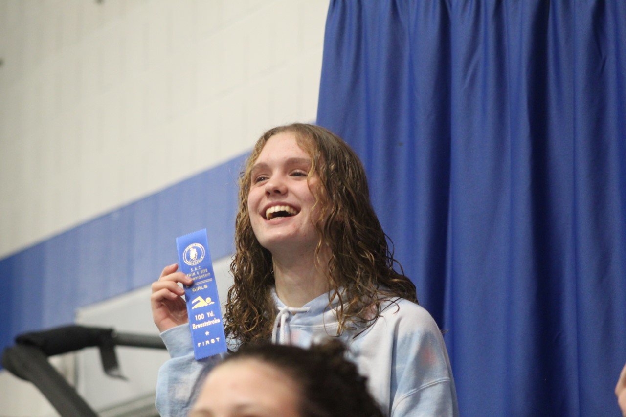 Guinevere Schmitzer-Torbert was all smiles after swimming her way to the SAC title in the 100 breaststroke.