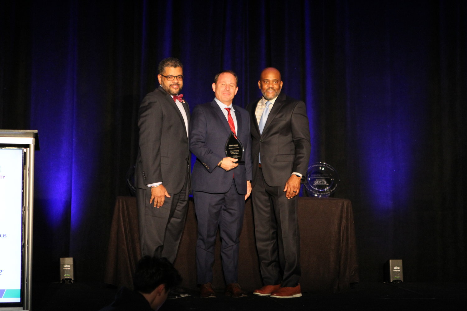 MXIBS Director Steven Jones ’87, left, and Wabash President Scott Feller receive a Champions of Diversity recognition from the Indiana Minority Business Magazine.