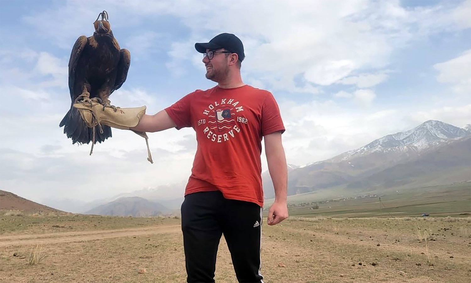 Benjamin Bullock studied abroad in Vladivostok, Russia, and Bishkek, Kyrgyzstan, in the Spring of 2022. He is pictured holding an eagle in the countryside of Kyrgyzstan.