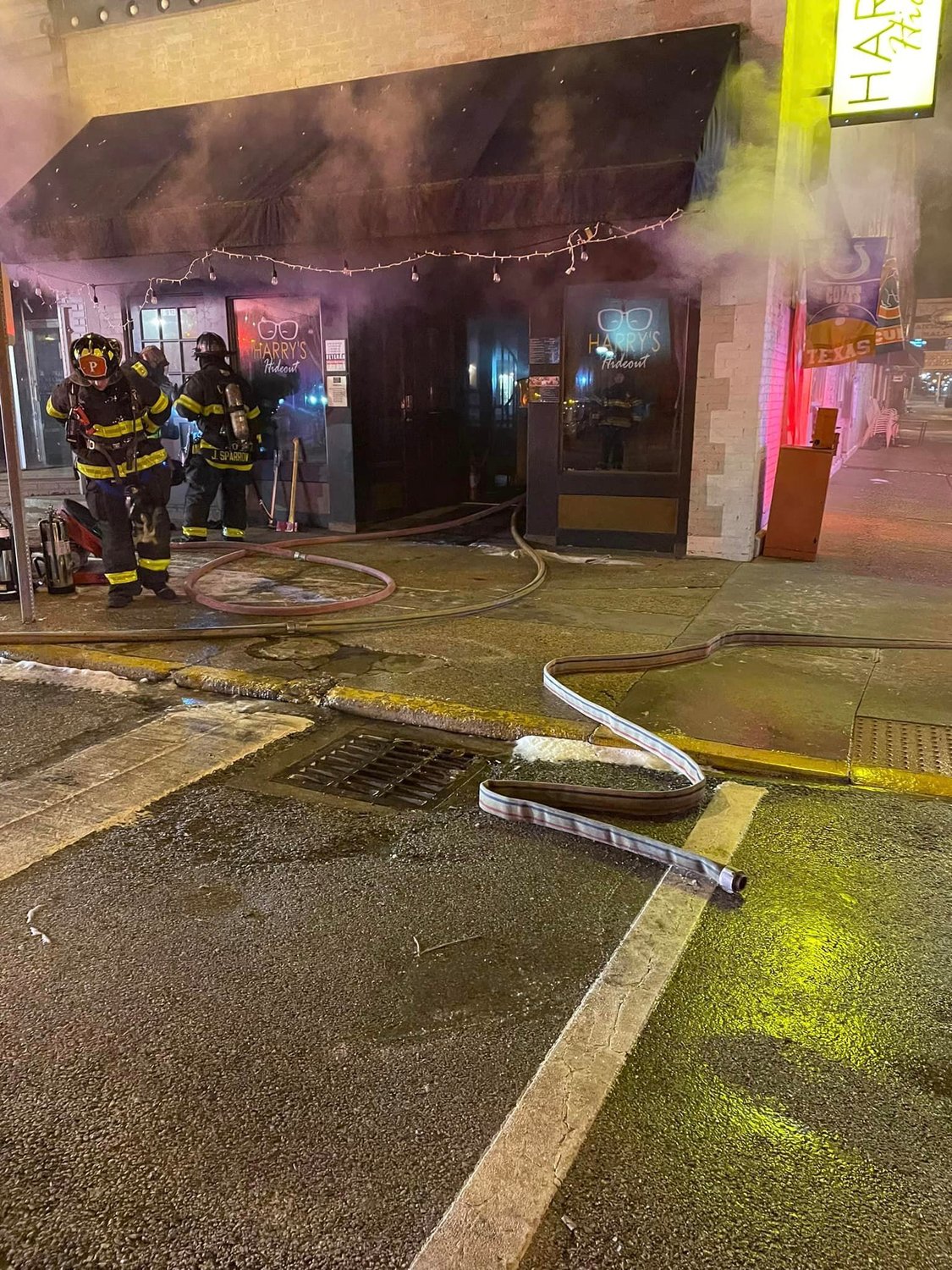 Crawfordsville firefighters respond at 3 a.m. Wednesday to a fire at Harry’s Hideout on the corner of East Main and South Washington streets.