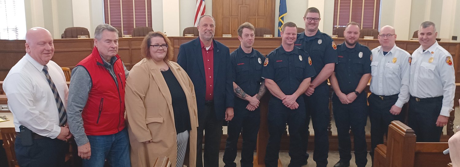 Pictured, from left, are Mayor Todd Barton, Dave Williamson, Ashley Shiraz, Kraig Kinney, Brendan Mitchell, Andrew Traylor, Mitchell McCollum, Joel Sietsma, Battalion Chief Nate Patton and EMS Division Chief Paul Miller.
