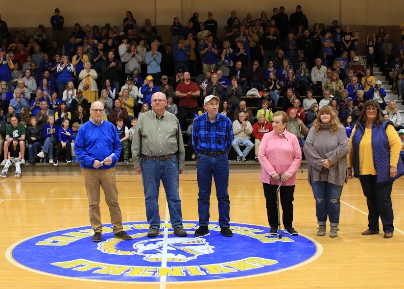 From L-R: Crawfordsville honored former coaches Brad Acton and Gary Lester, retired Athletic Director Bruce Whitehead, and Dottie, Debbie, and Dawn Curtis members of the Paul Curtis family.