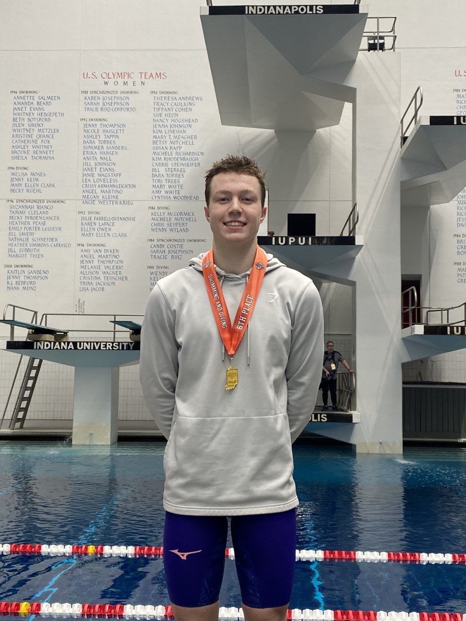 Crawfordsville’s Whitman Horton stands on the podium for his 6th place finish in the 100 backstroke at the IHSAA Boys Swim State Finals. It’s the 1st time since 2007 (excluding diving) that a CHS swimmer has stood on the podium.