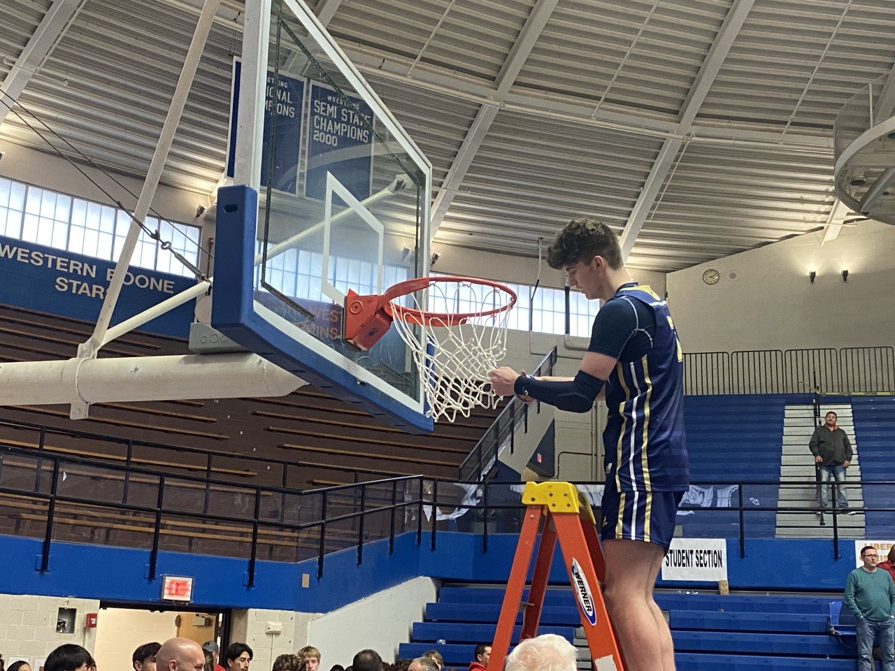 Will Harmon cuts down the net as the junior hit five straight free-throws in the final 16 seconds to give the Mustangs the lead for good.