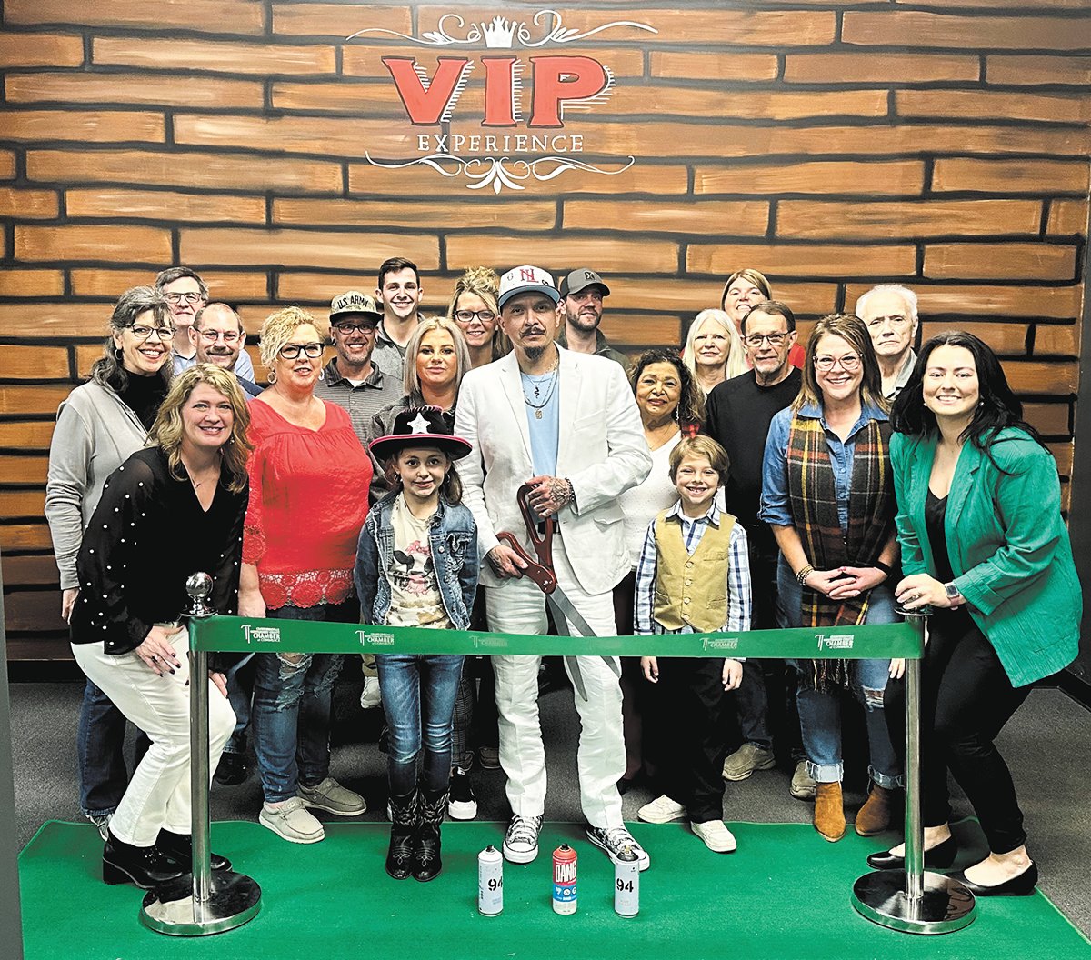 Ronnie Walters of Mystica Creations began his artwork painting customized tennis shoes and streetwear. Members of the Chamber of Commerce helped him celebrate a ribbon cutting.
