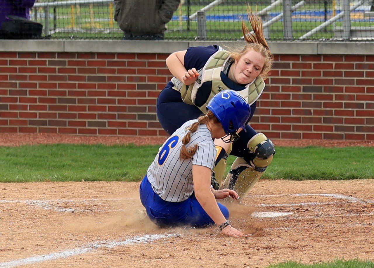 Fountain Central catcher Katie Brown makes a tag at home on Crawfordsville's Celeste Moore as the Mustangs picked up their first win of 2023 defeating CHS 18-4.