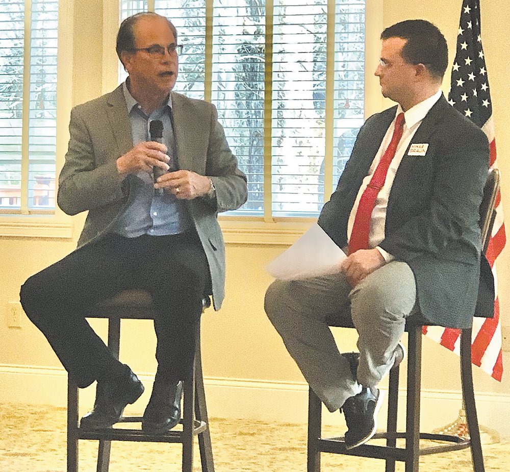 Sen. Mike Braun, left, answers a question Thursday from Montgomery County Republican Party Chairman Jim Johnson at the annual GOP Lincoln Day Dinner at the Crawfordsville Country Club.