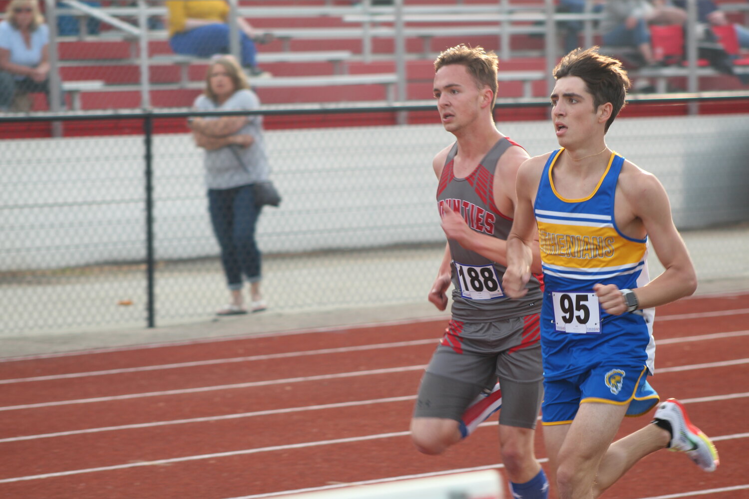 Crawfordsville's Ryan Miller and Southmont's Mason Cass go neck and neck during the 3200M run.