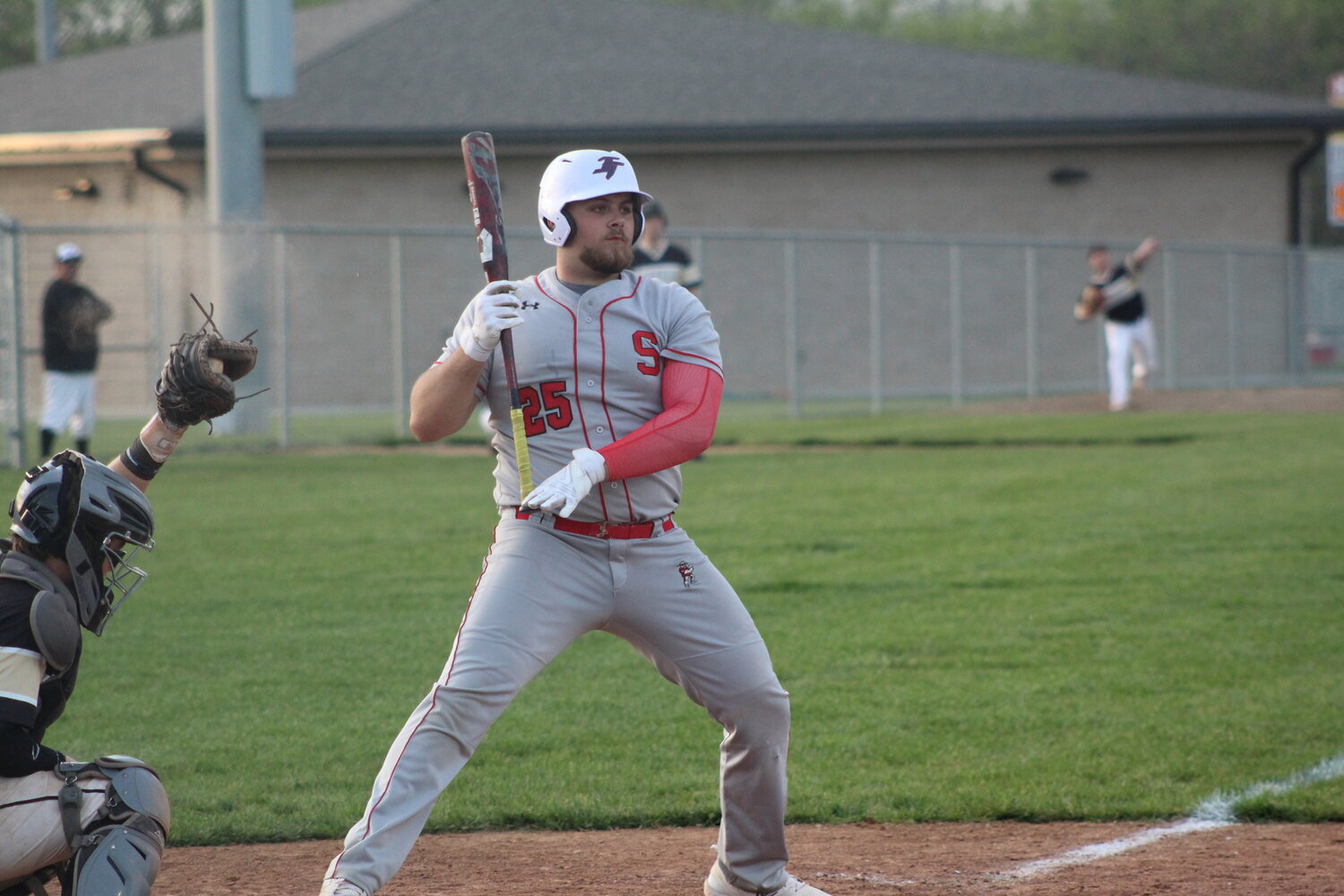 Senior slugger Mason Hall moves out of the way of a pitch that was high and inside.