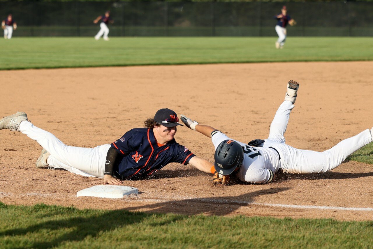 Austin Sulc makes a diving tag for an out at third base during the Chargers 6-4 loss at Tri-West on Tuesday.