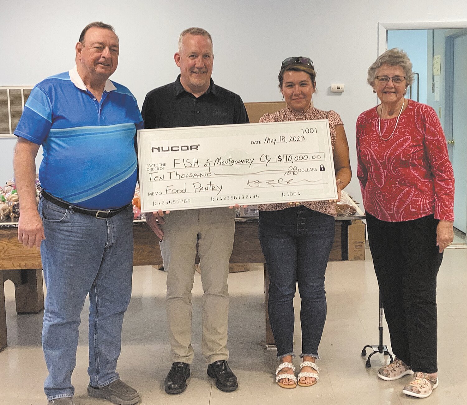 The FISH Food Pantry was the recipient of a generous corporate donation from Nucor Steel. Representatives of Nucor, Haley Kunkel and Phil Littell, presented FISH board members with a check for $10,000. Pictured, from left, are FISH treasurer Bernie Williams, Littell, Kunkel and FISH president Linda Cherry.