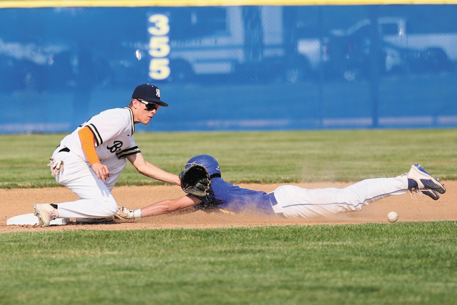 Wyatt Motz slides in under the tag for Crawfordsville during their sectional game against Tri-West.