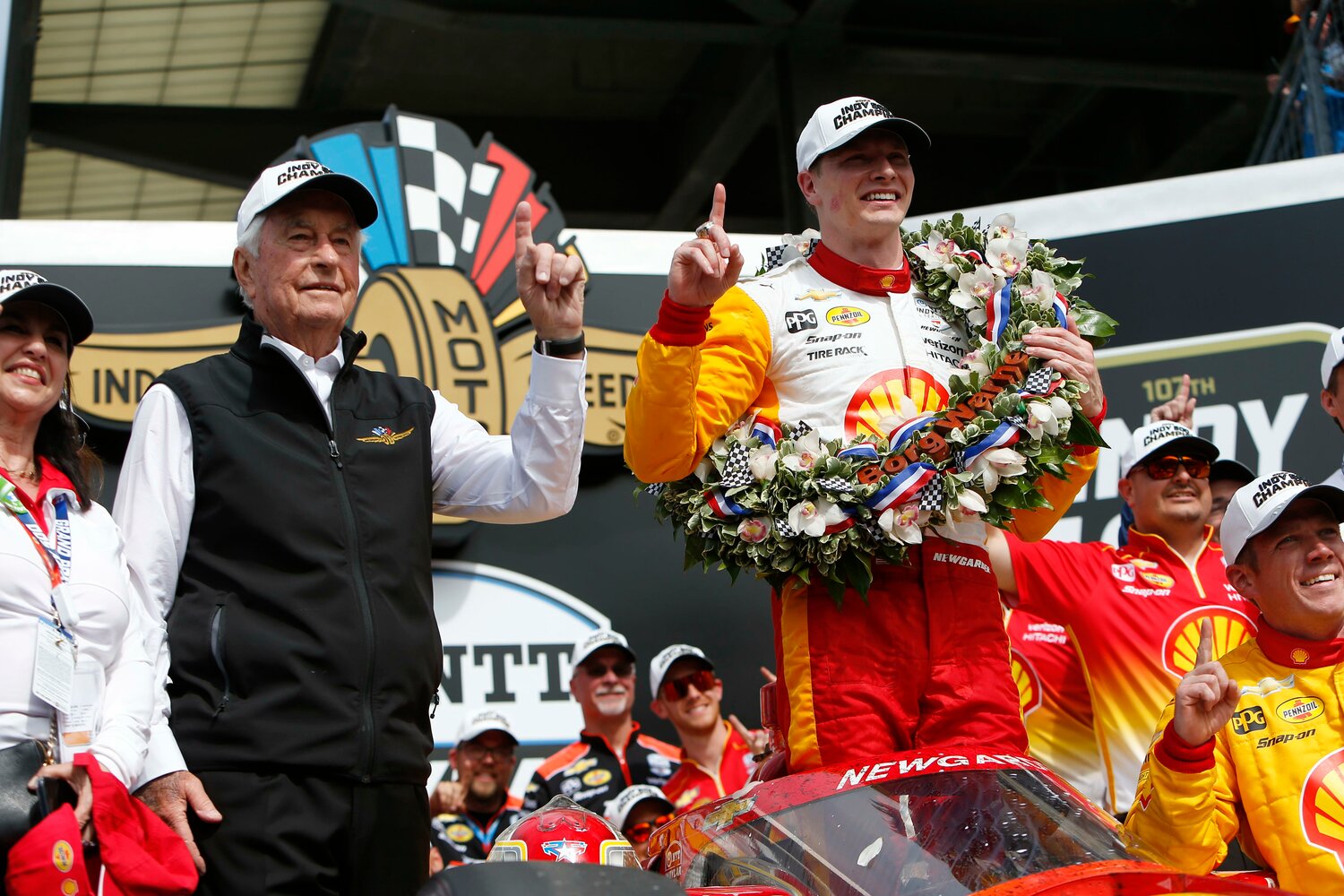 Newgarden along with track owner Roger Penske celebrate the championship. Newgarden became the 19th Team Penske driver to win the "Greatest Spectacle in Racing".