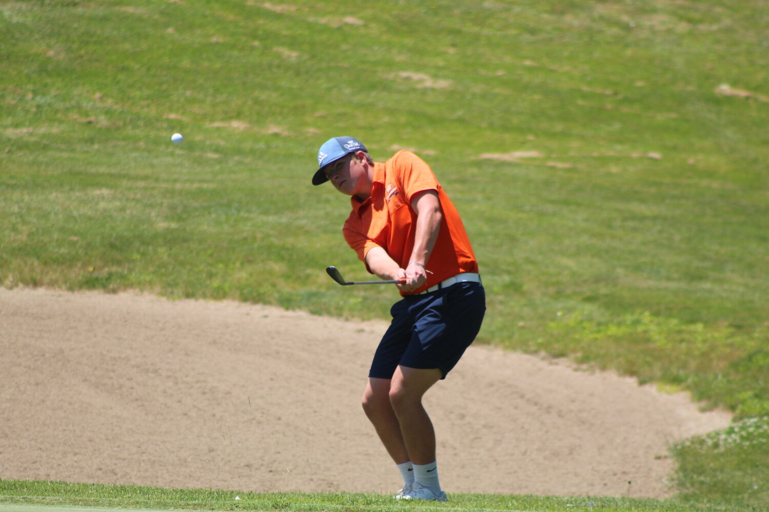North Montgomery’s Hayden Turner chips this shot onto the green. The Charger senior went on to win overall medalist with in a two-hole playoff.