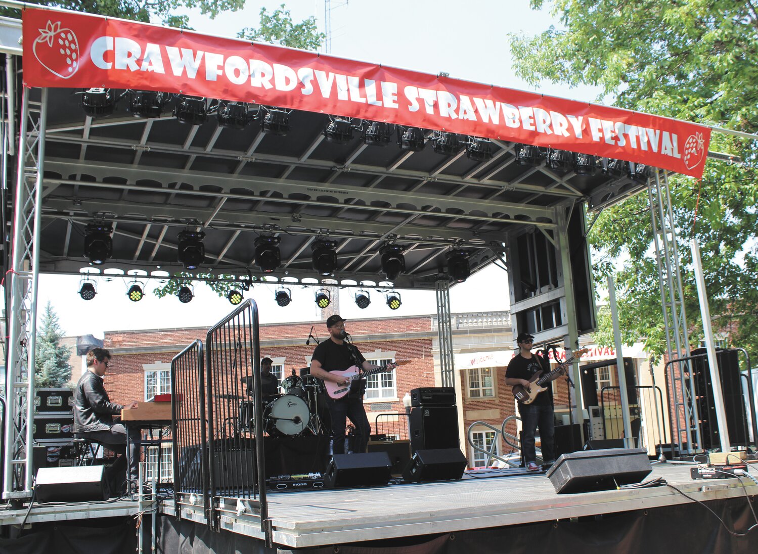 Members of the Zach Day Band perform Friday during the opening day of the 2023 Strawberry Festival.
