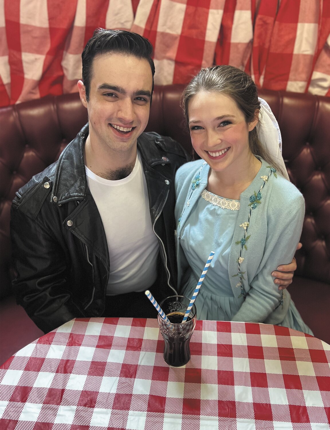Danny (Cooper Fitch) and Sandy (Anya Burke) rekindle their summer romance in Grease, running from Friday to July 29 at Myers Dinner Theatre in Hillsboro.