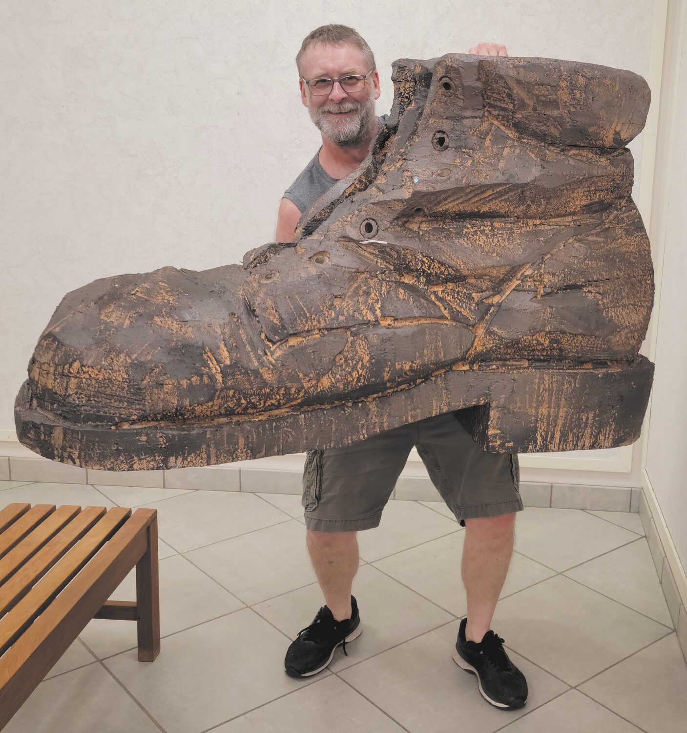 Tony Woodall helps install the August Kochanowski exhibit at the Crawfordsville District Public Library.