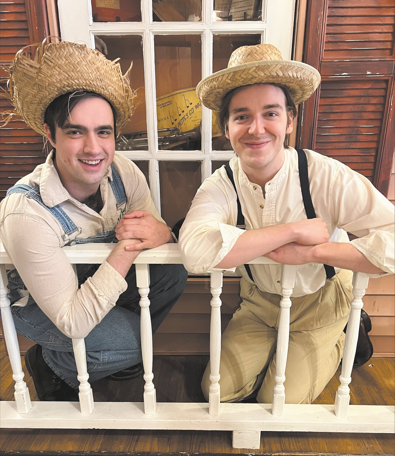 Cooper Fitch (Huckleberry Finn) and Matthew Porter (Tom Sawyer) on Aunt Polly's porch talking about the adventures ahead of them.