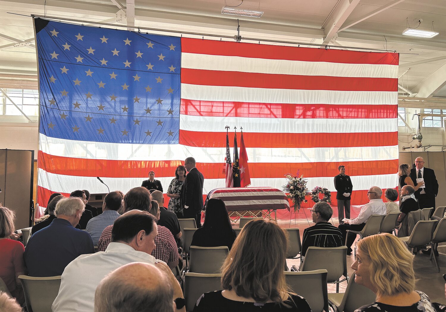 Family, friends and military personnel attend the funeral service for Retired Major General Richard "Dick" Chastain on Thursday in the Crawfordsville Armory.