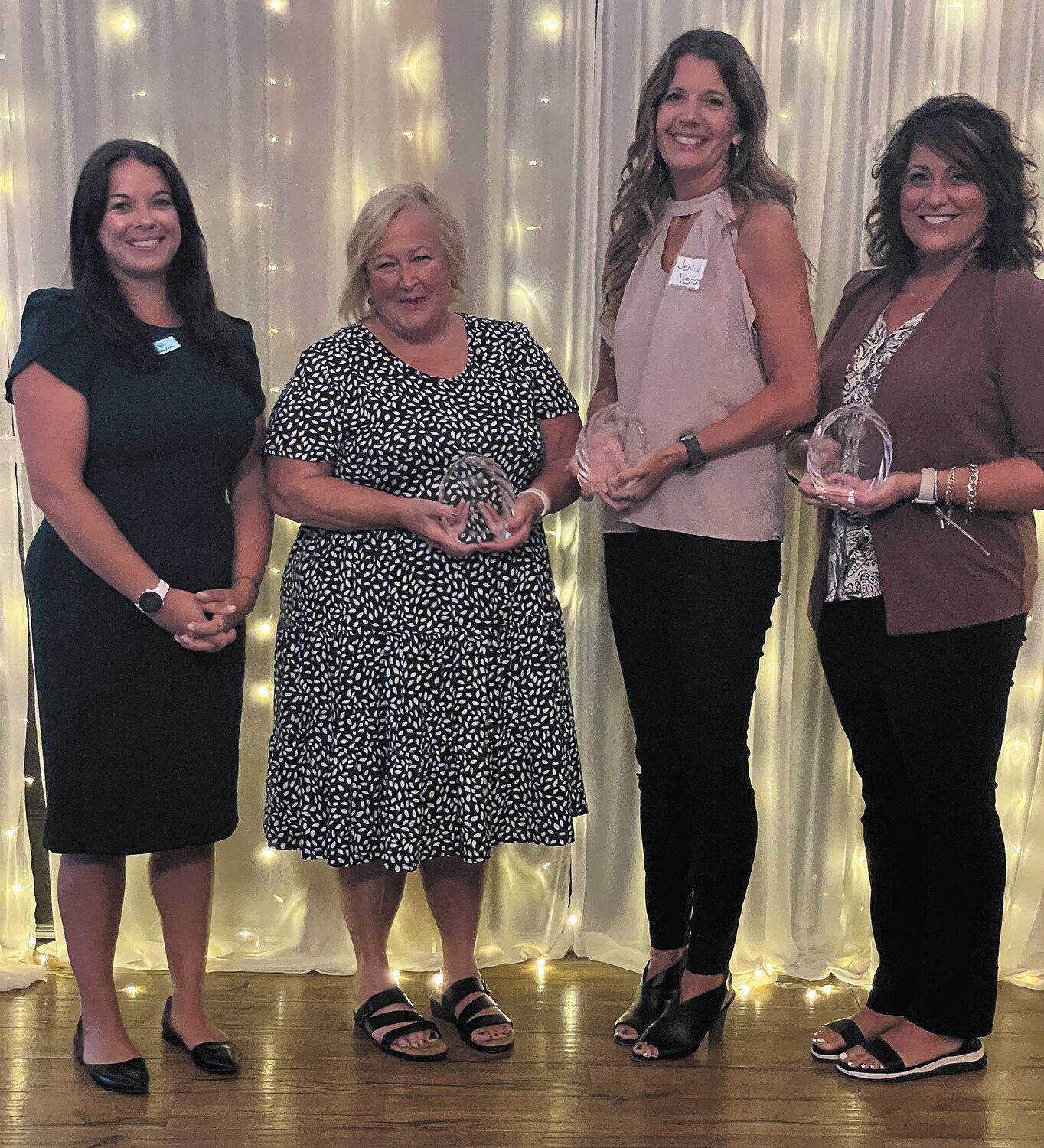 Joy Jarvis, second from left, Jenny Veatch and Erin Jones were named Emerald Educators of the Year.