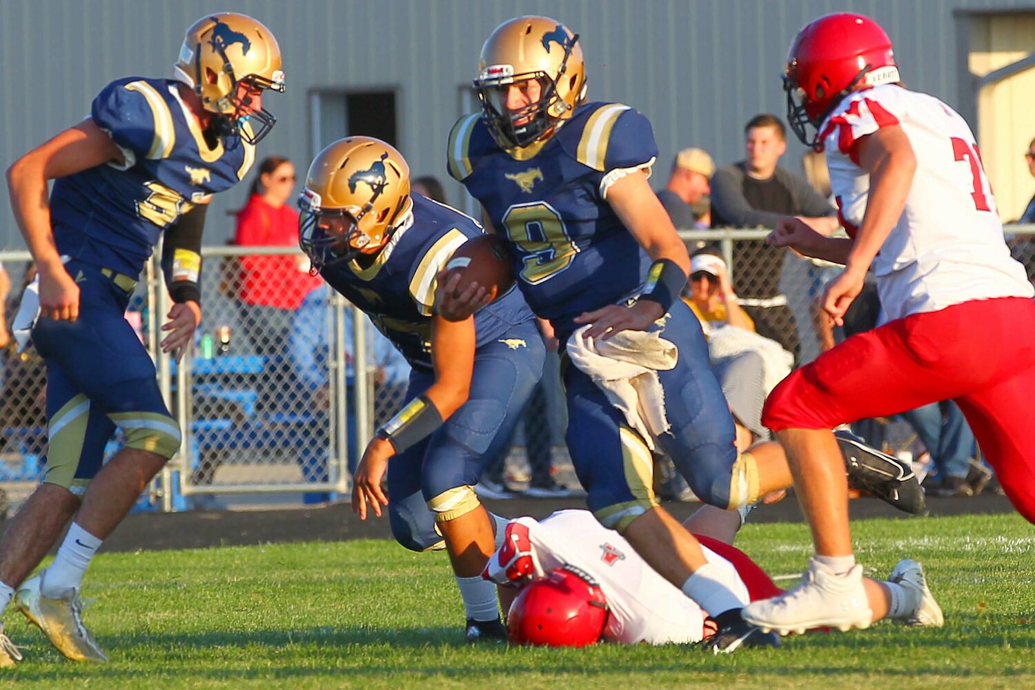 Owen Acton of Fountain Central - breaking through a hole in the Attica line for a gain of ten yards