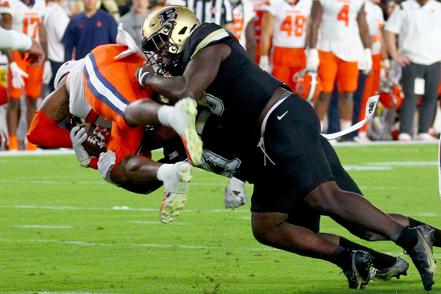 O.C. Brothers (8) and Sanoussi Kane of Purdue - tackling LeQuint Allen Jr of Syracuse