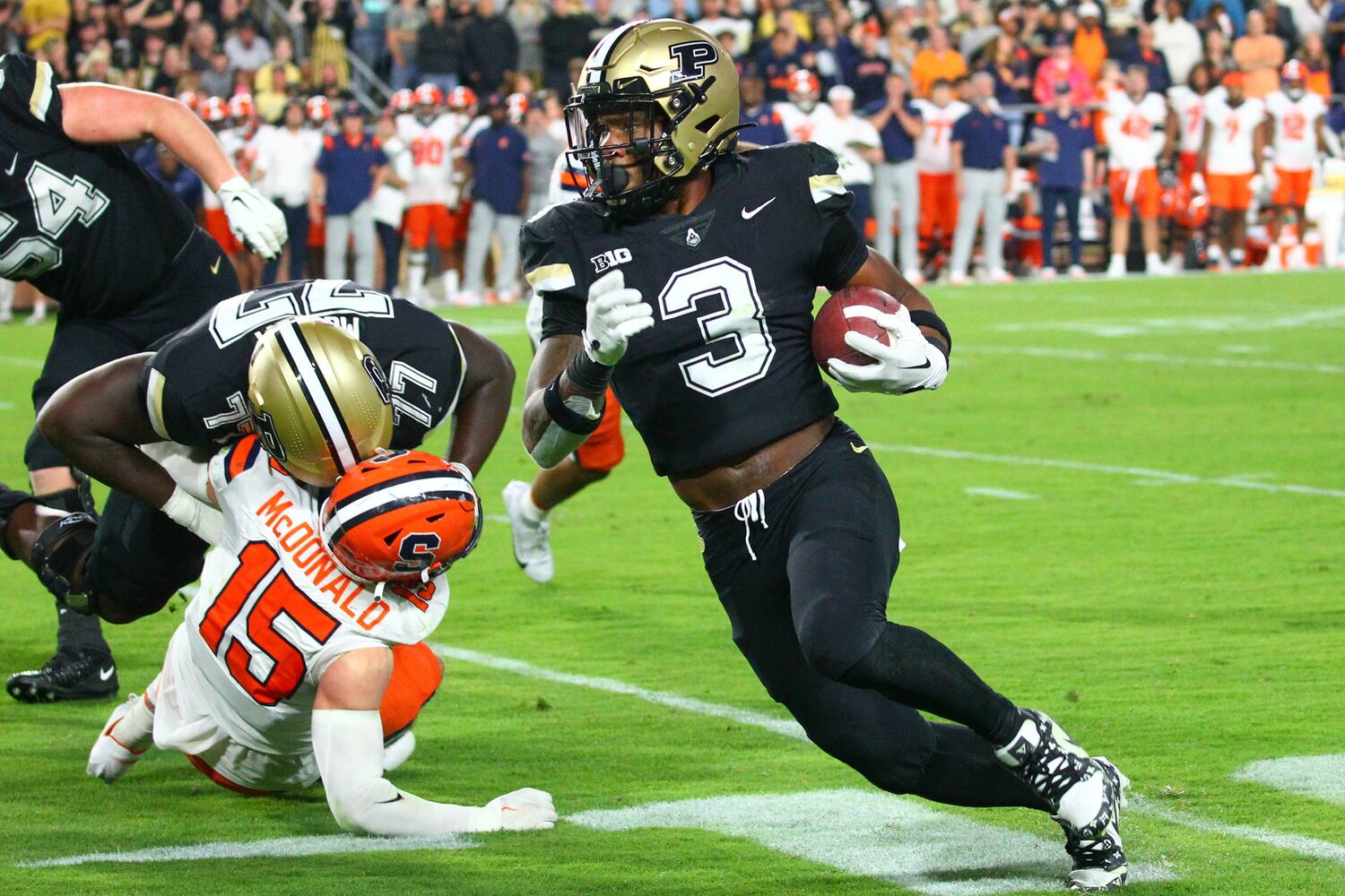 Tyrone Tracy of Purdue - using a block by Mahamane Moussa to gain six yards