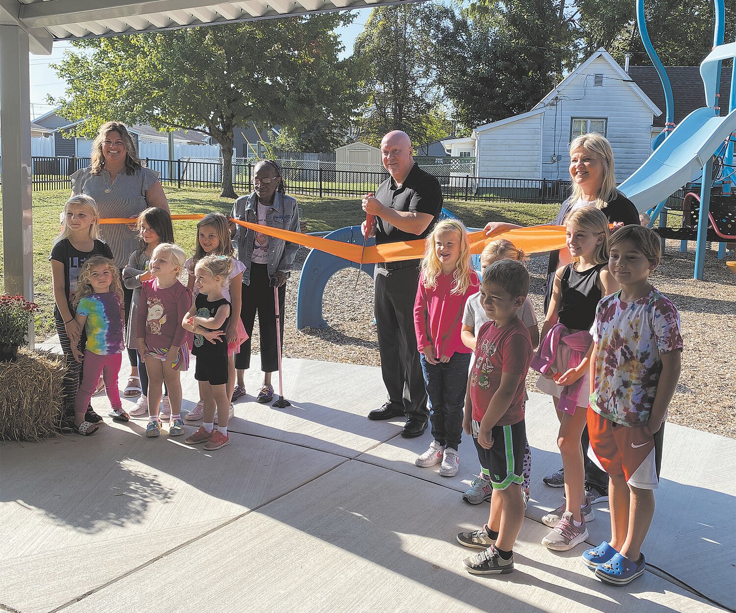 Crawfordsville Mayor Todd Barton, center, cuts the ceremonial ribbon Saturday at the renovated Frances Wooden Park. Also pictured, are Fawn Johnson, far left, from the parks department, and Kelly Taylor, far right, from the Montgomery County Community Foundation.