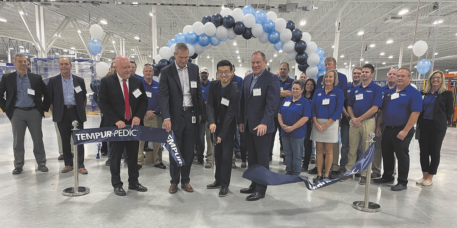 Tempur Sealy celebrated the opening of its newest manufacturing facility in Crawfordsville. Helping cut the ceremonial ribbon Thursday, are, from left, Mayor Todd Barton; Scott Vollet, EVP of Global Operations; Tao Zhu, Director of Manufacturing; and Cliff Buster, North American CEO.