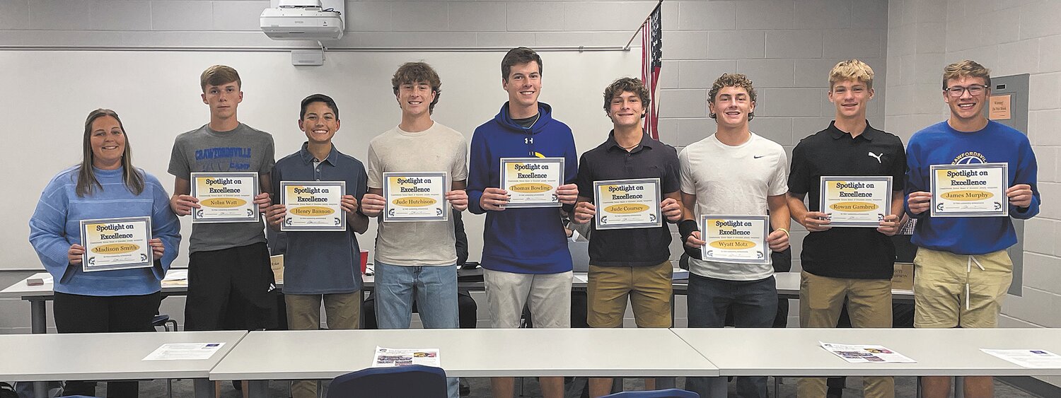 Members of the varsity boys tennis team and coaching staff were recognized Thursday during the school board meeting. Pictured, from left, are Coach Madison Smith and players Nolan Watt, Henry Bannon, Jude Hutchison, Thomas Bowling, Jude Coursey, Wyatt Motz, Rowan Gambrel and James Murphy. Not pictured is Coach Craig Brainard.