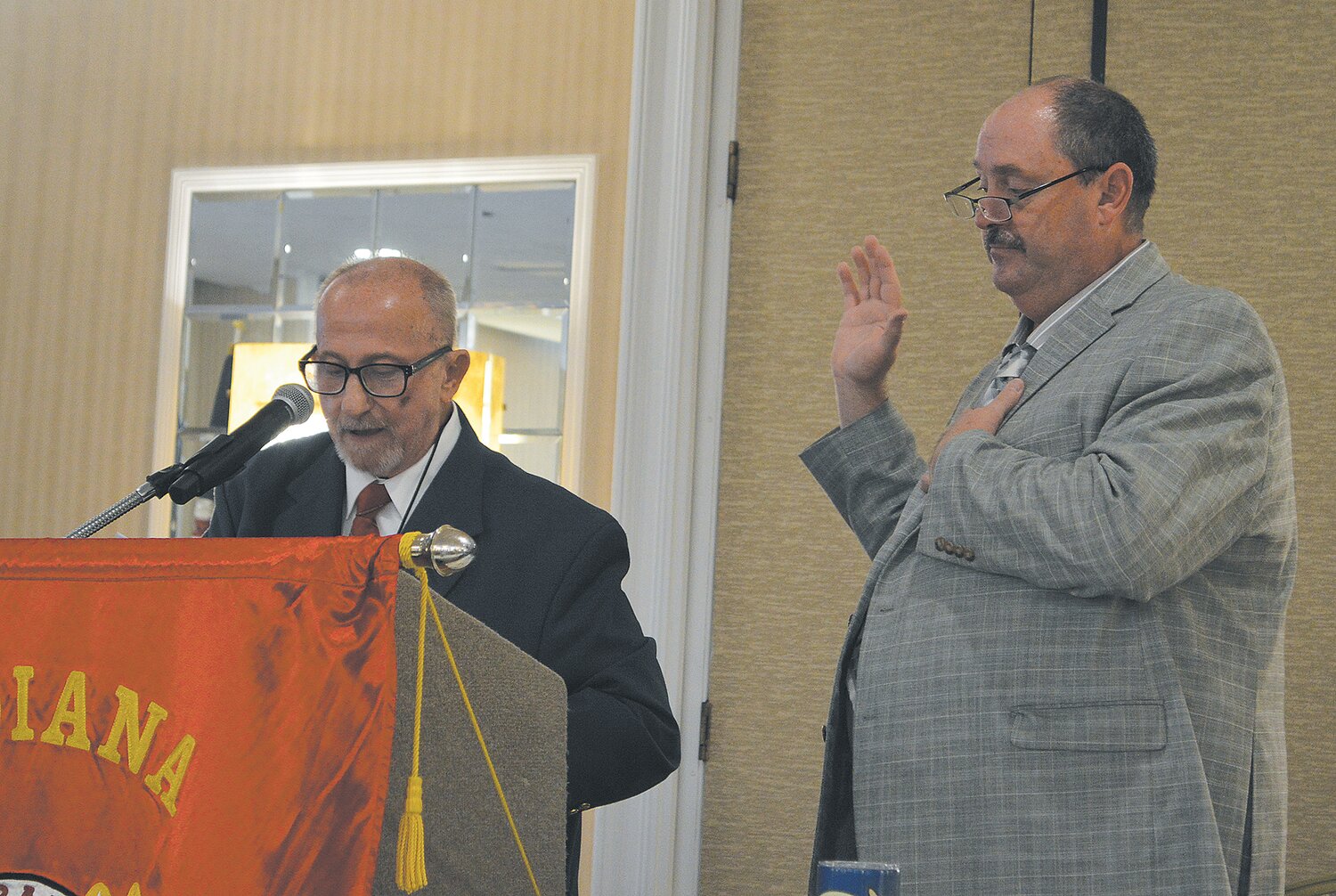 Henry Carrell, right, is being sworn in by Ed Chandler from Jasper.