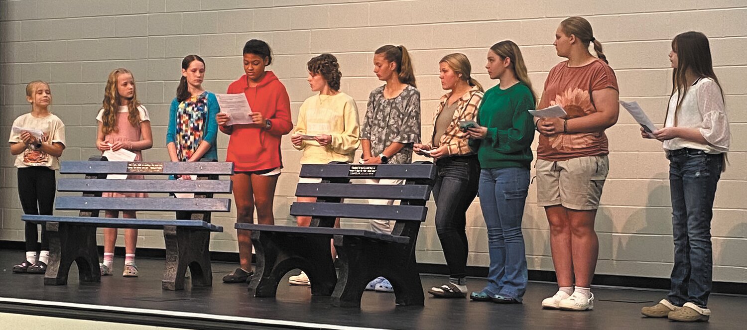Members of the Crawfordsville Middle School A-Team share information about the memorial bench project during a ceremony in September.