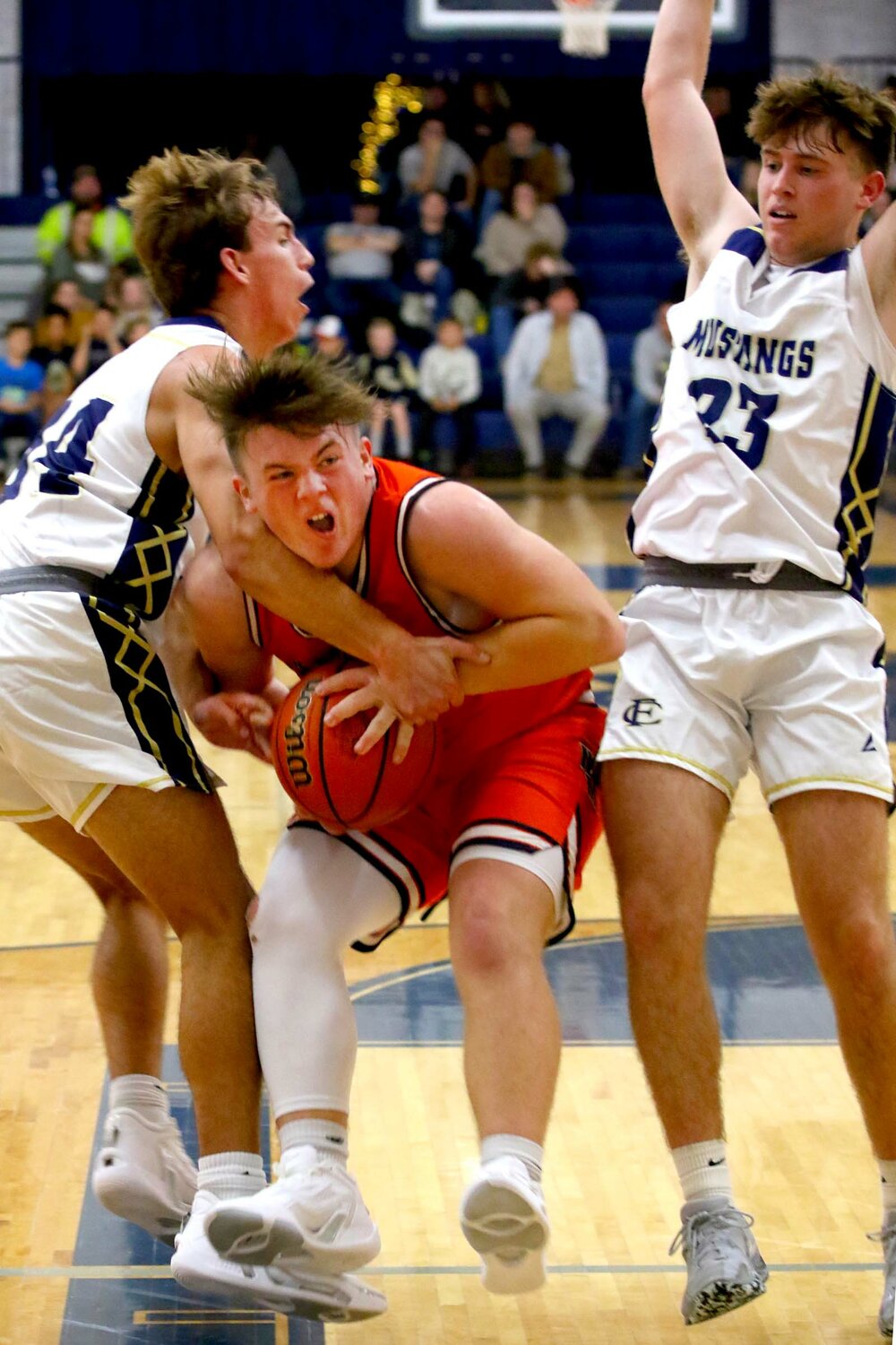 Ross Dyson of North Montgomery - trying to drive past Brayden Prickett of Fountain Central as Koby Wolf (23) tries to avoid a collision