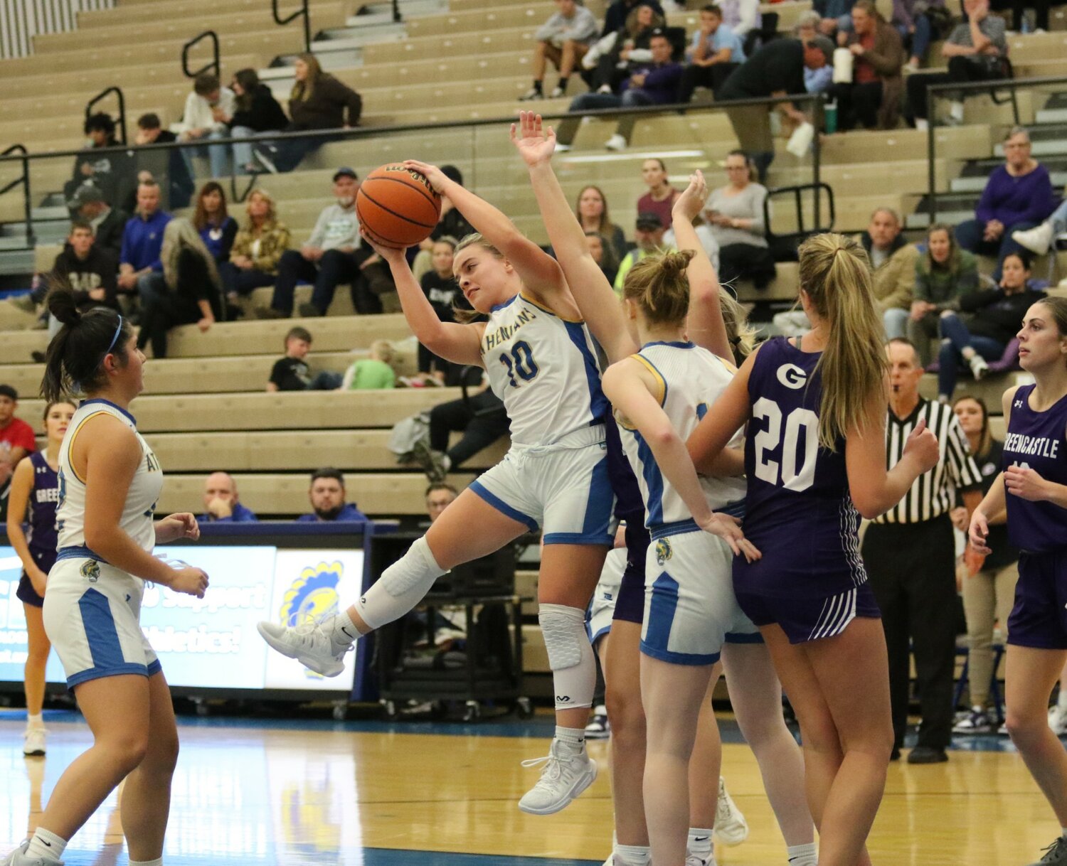 Molly Pierce skies for this rebound during the girls game.