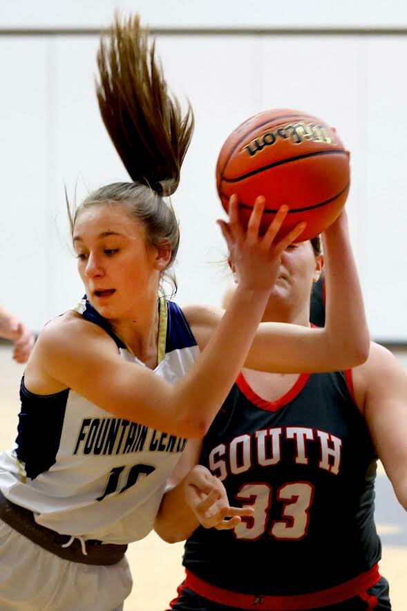 Brailey Hoagland of Fountain Central - grabbing a defensive rebound in front of Layla Gomez of Southmont