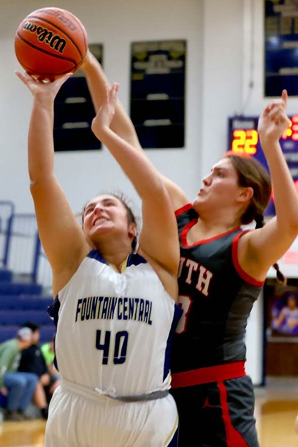Kacey Kirkpatrick of Fountain Central - shooting a short jumper against the defense of Layla Gomez of Southmont
