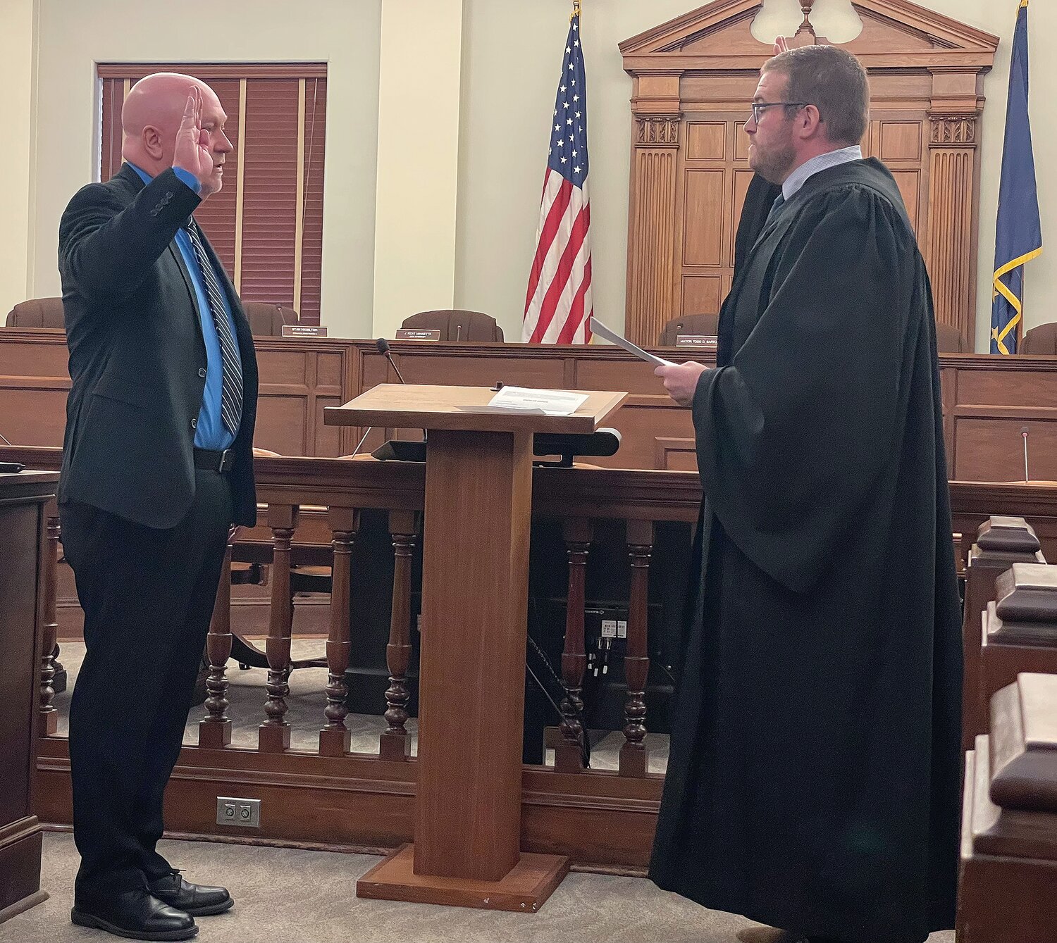 Mayor Todd Barton, left, takes an unprecendented fourth oath of office on Monday in the council chamber of the City Building. Montgomery County Superior Court II Judge Daniel Petrie administers the oath.