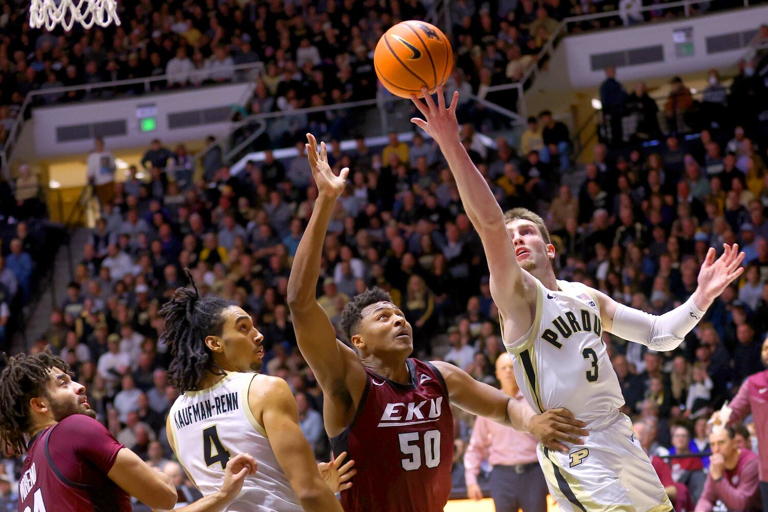 Braden Smith of Purdue - scooping a lay-up over Isaiah Cozart of Eastern Kentucky