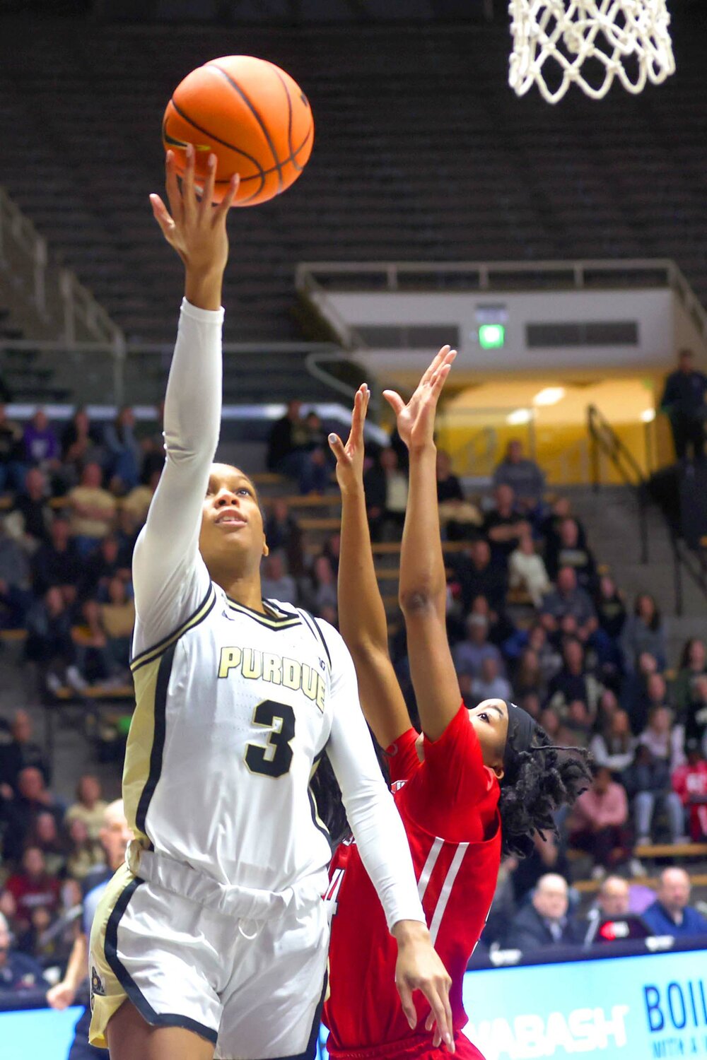 Jayla Smith of Purdue - scooping lay-up over Lisa Thompson of Rutgers