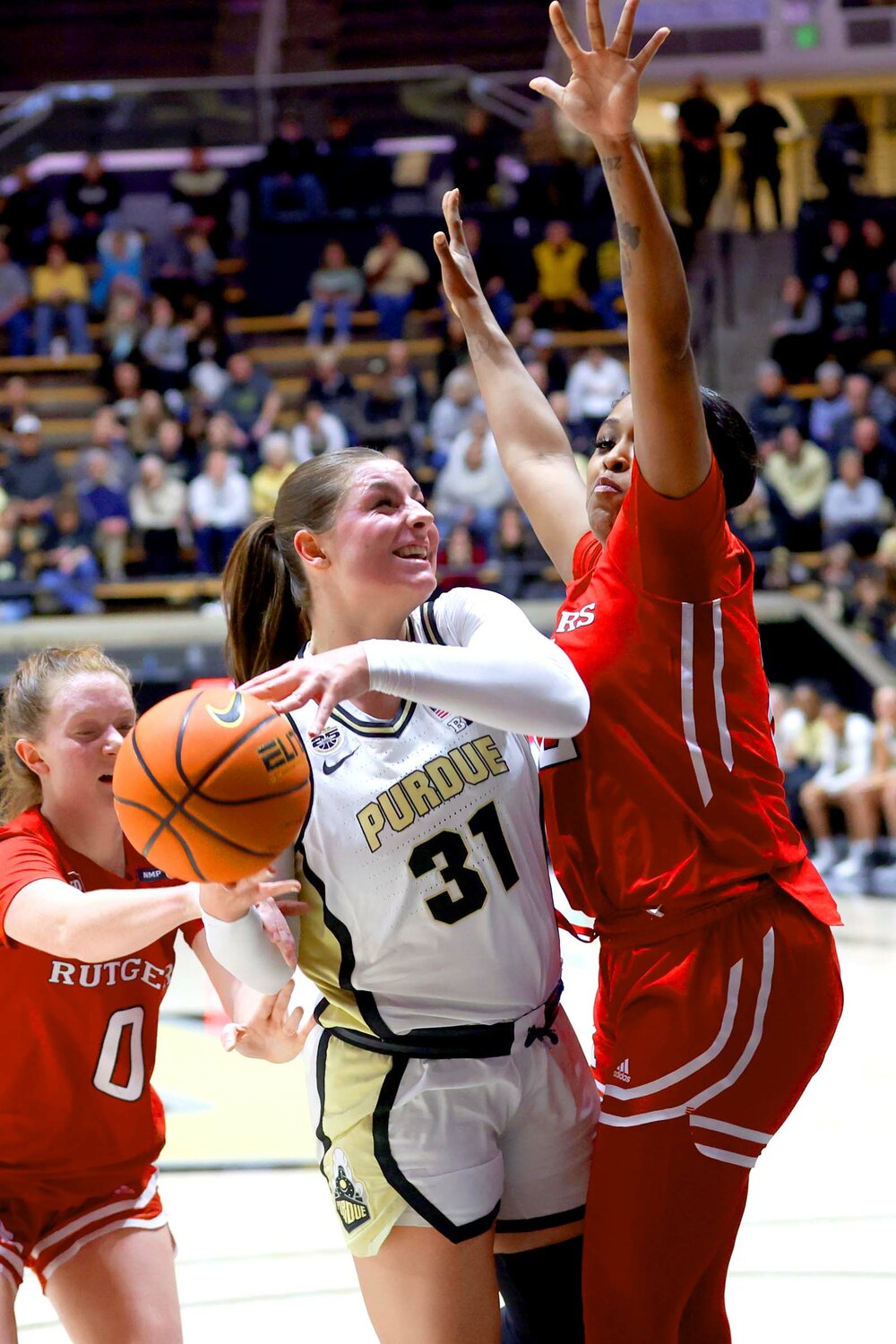Sophie Swanson of Purdue - being fouled on lay-up by Kassondra Brown of Rutgers