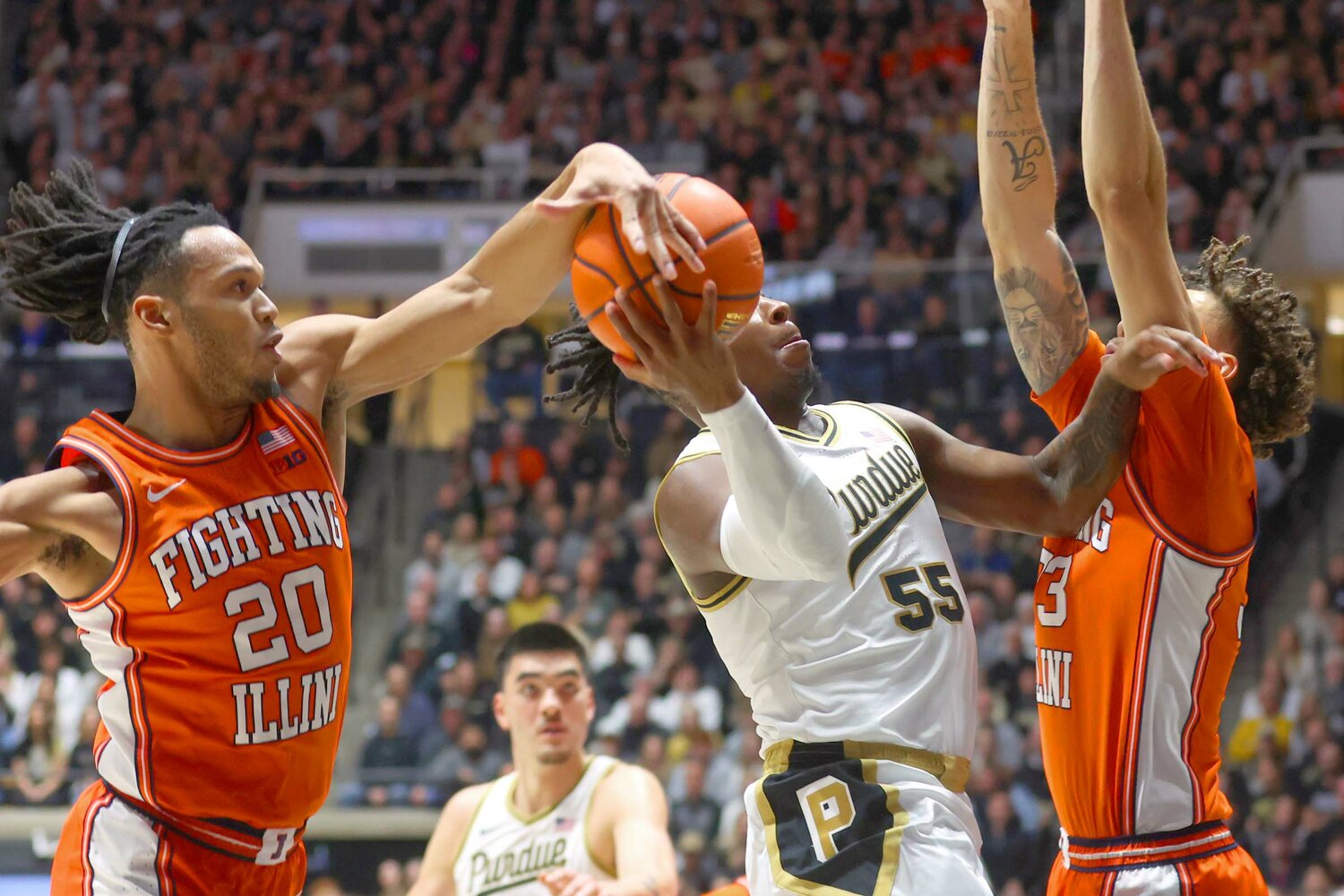 Ty Rodgers of Illinois - blocking shot by Lance Jones of Purdue