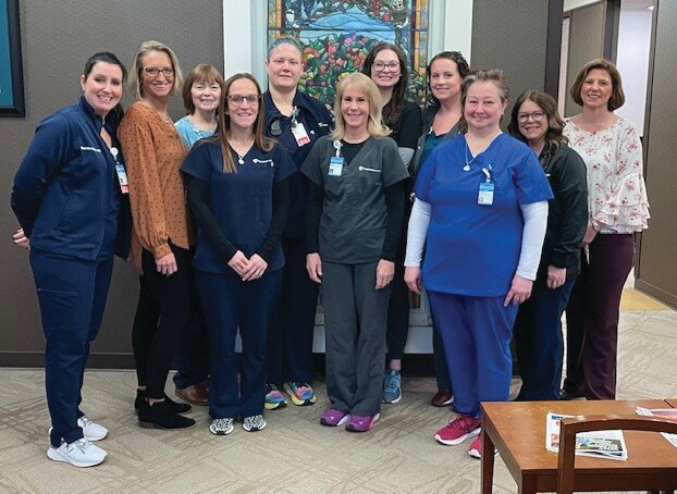 Marie Canine Cancer Center staff pose for a photo.