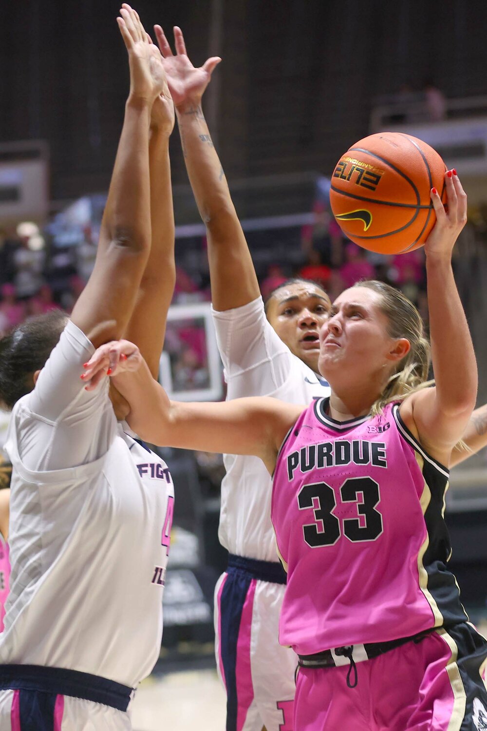Madison Layden of Purdue - going up for shot against Camille Hobby of Illinois